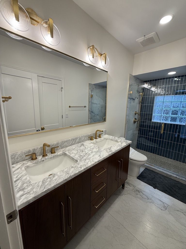 Full room view in daylight showing vanity and shower together