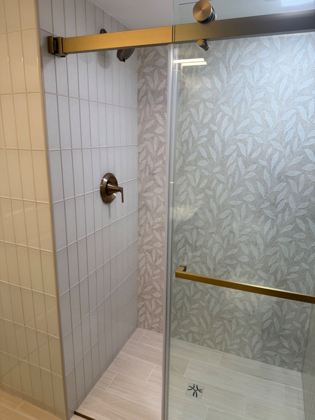 Shower wall detail with feature tile and glass
