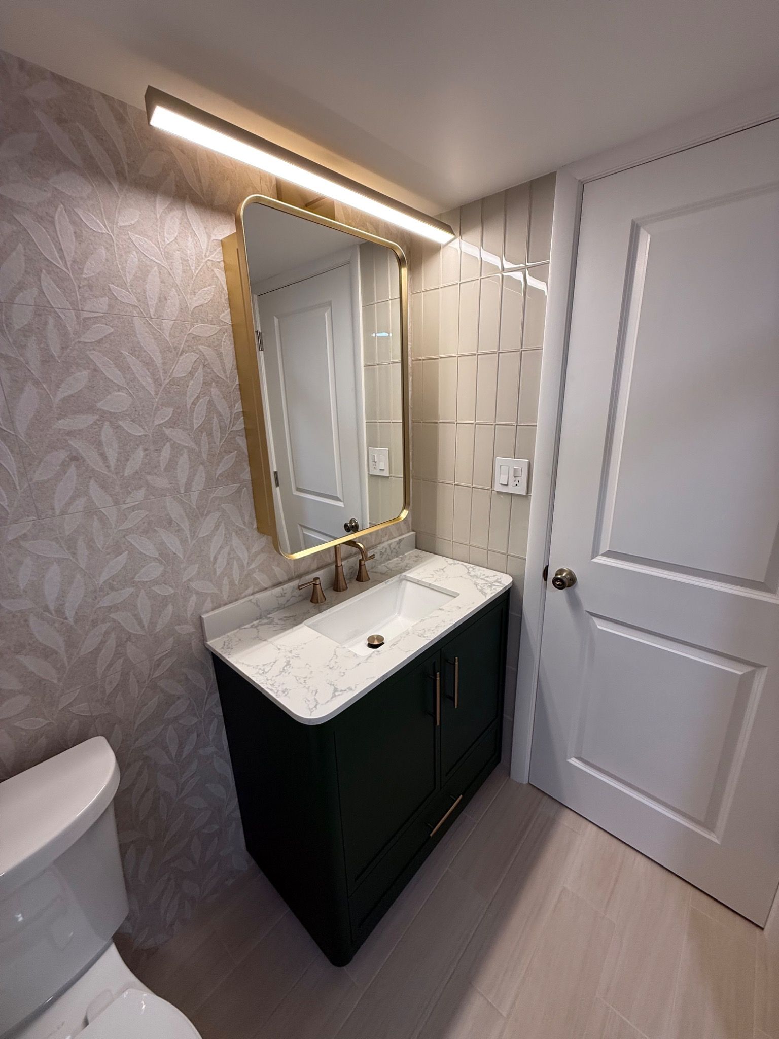 Angled view of the green vanity and mirror