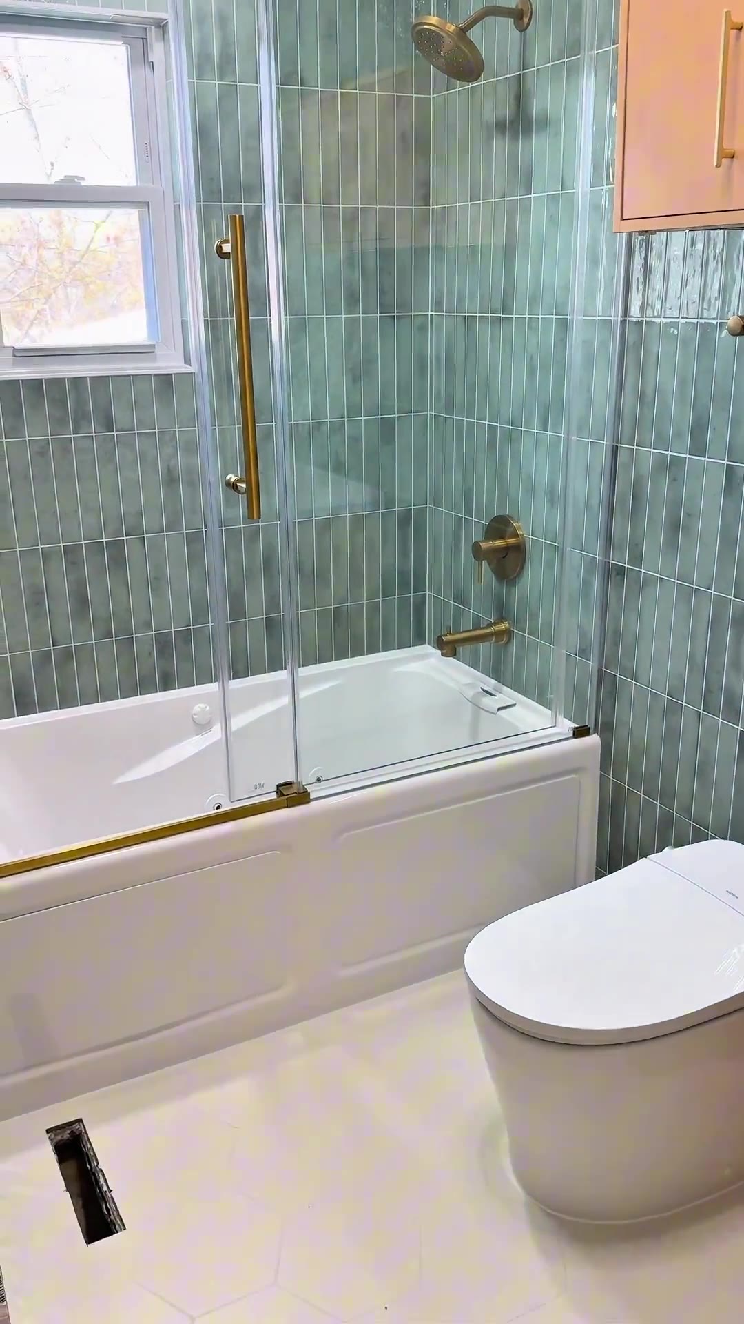 Video walkthrough of the finished tropical green tile bathroom
