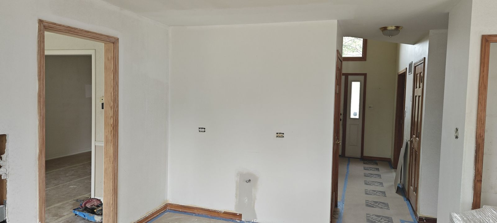 Adjoining hallway with walls patched and primed