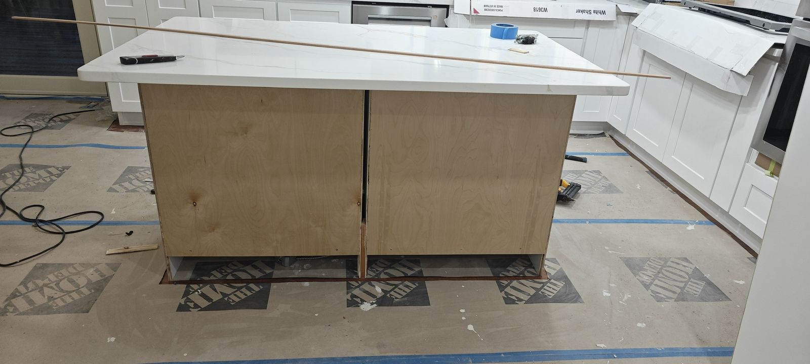Kitchen island cabinet box assembled with quartz top test-fit