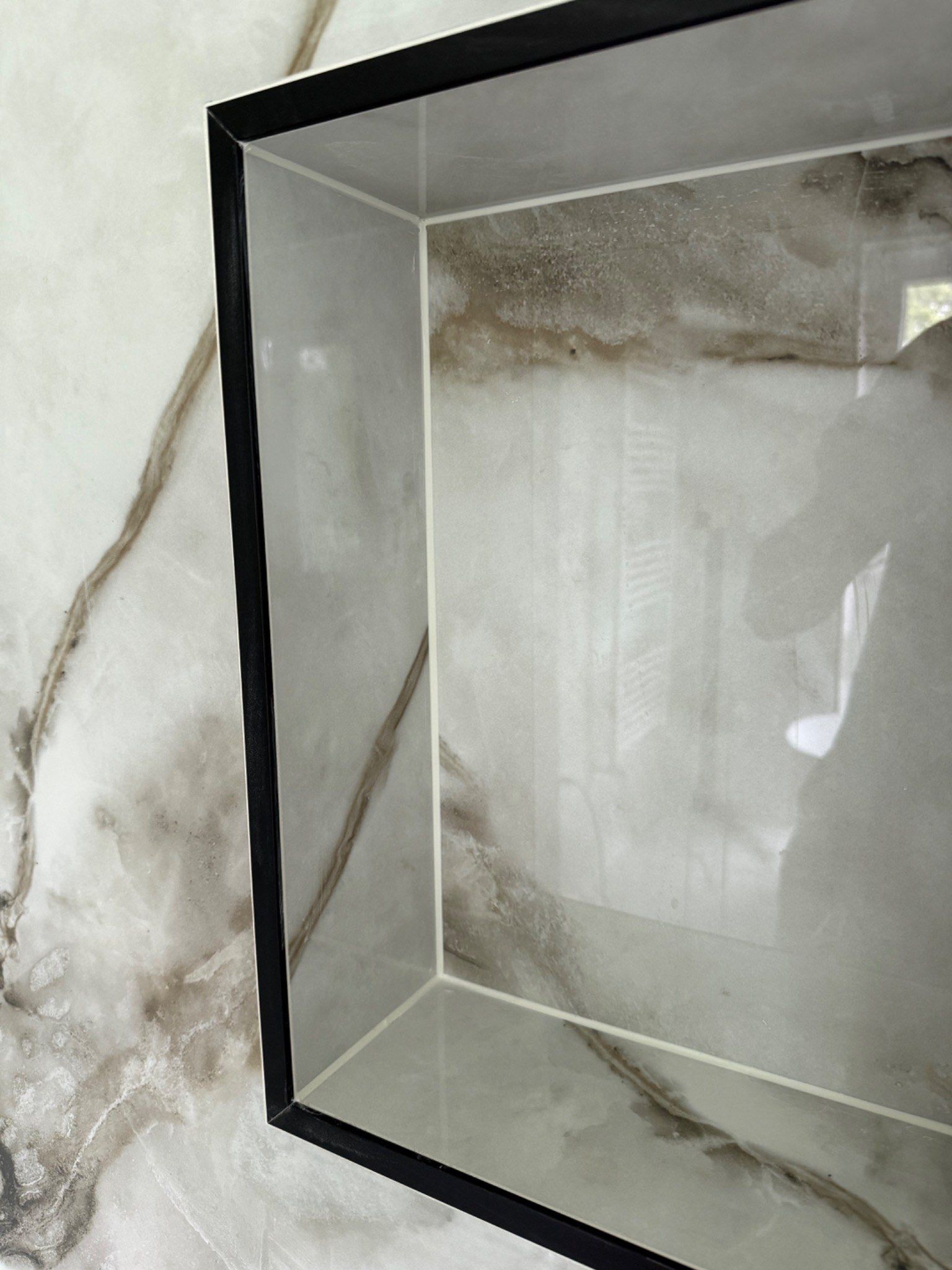 Close-up of the left shower niche corner correction