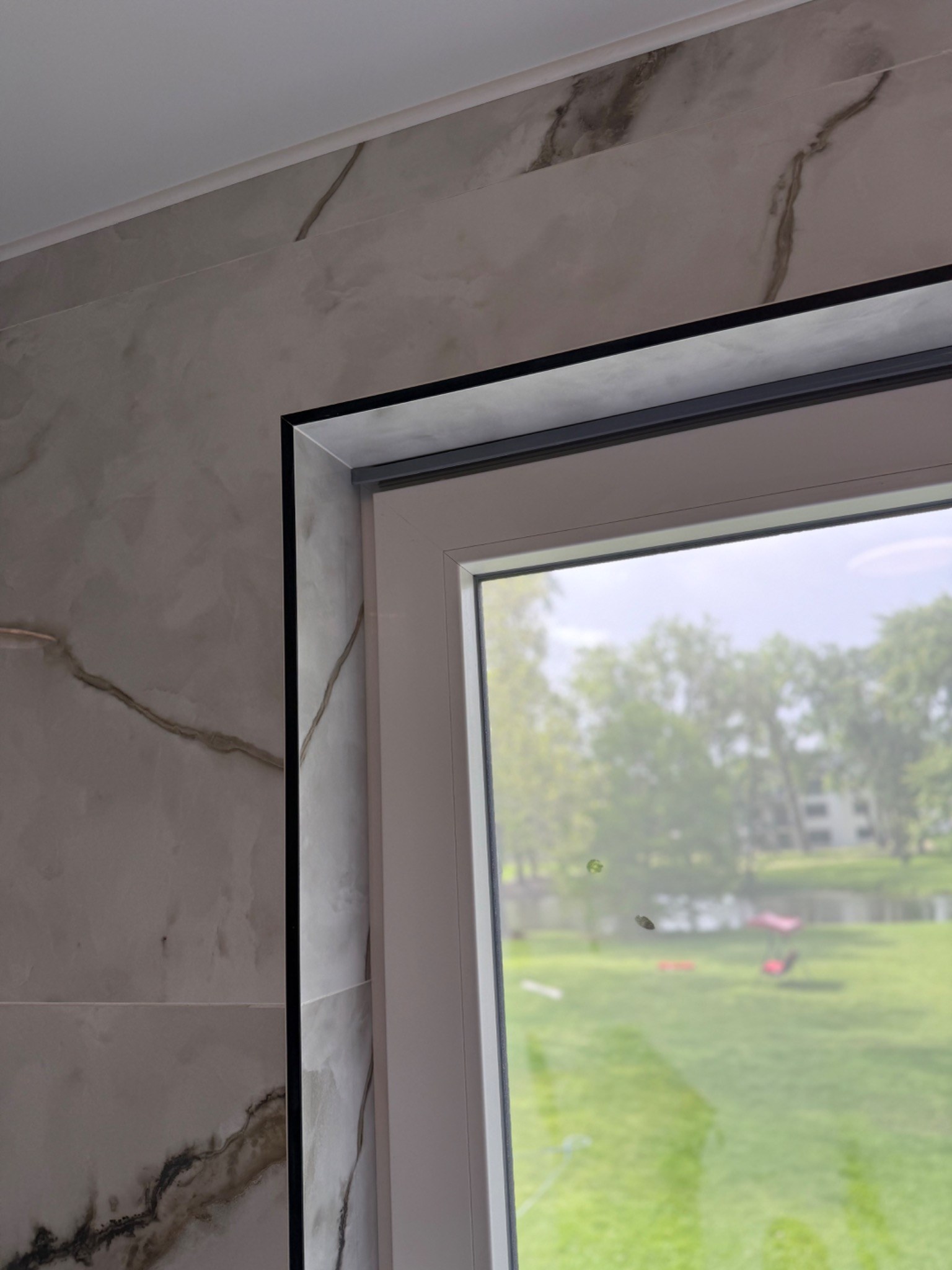 Left upper corner detail around tiled window return